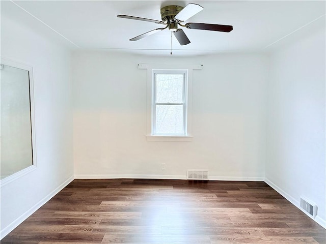 unfurnished room with ceiling fan and dark hardwood / wood-style flooring