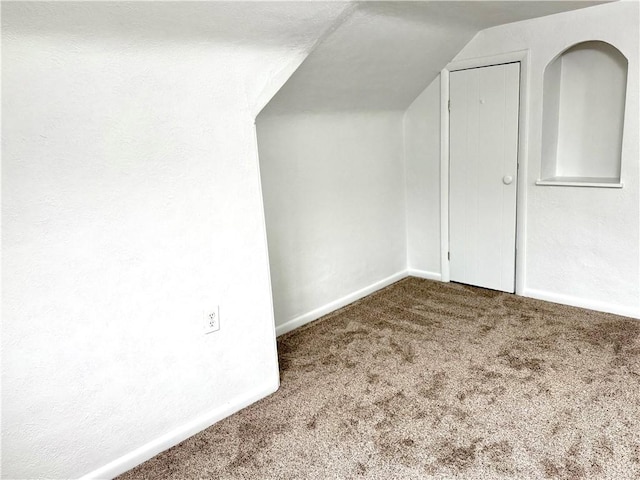 bonus room featuring carpet and lofted ceiling