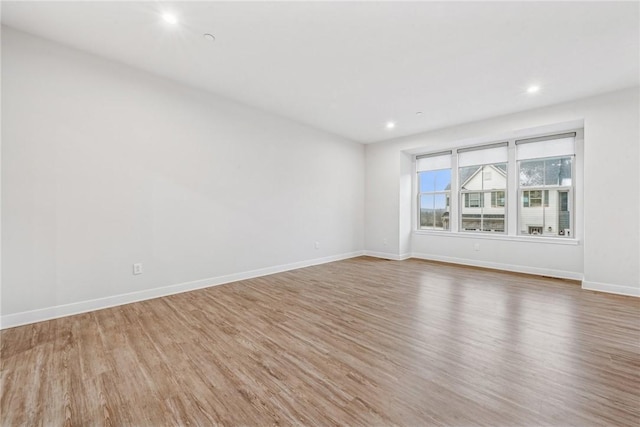 unfurnished room with wood-type flooring