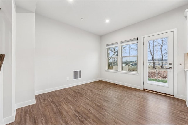 empty room featuring dark hardwood / wood-style floors