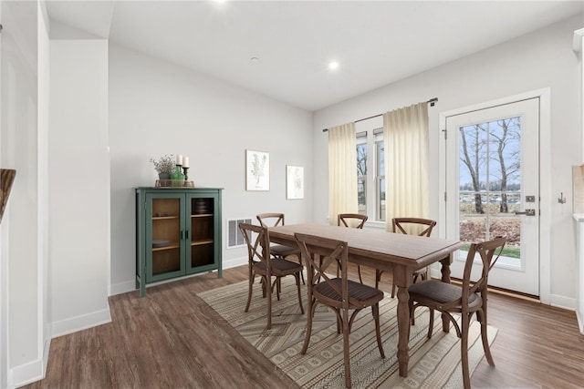 dining area with dark hardwood / wood-style floors