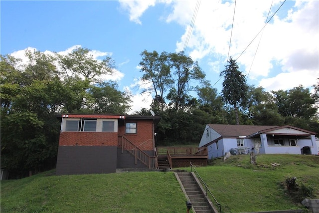 rear view of property with a yard