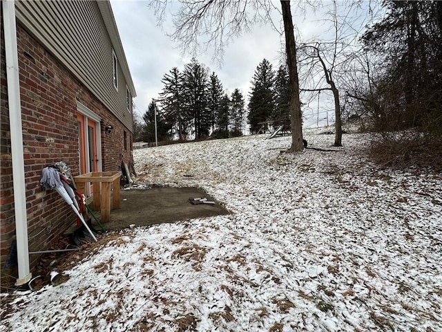 view of yard covered in snow