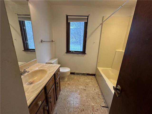 full bathroom with vanity, toilet, and shower / washtub combination