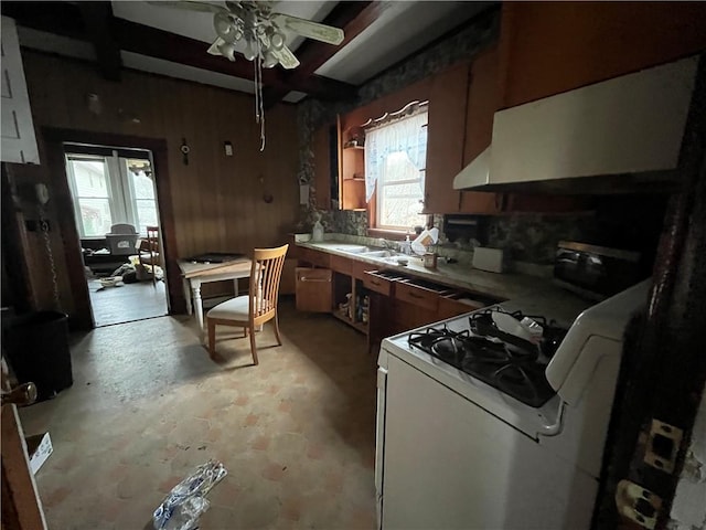 kitchen with plenty of natural light, white range with gas cooktop, and ceiling fan