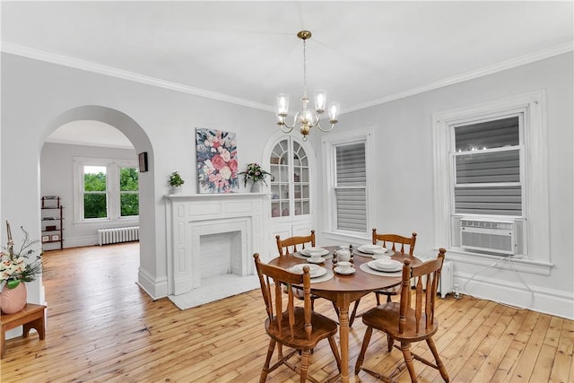 dining space featuring a chandelier, radiator heating unit, light wood-type flooring, and cooling unit