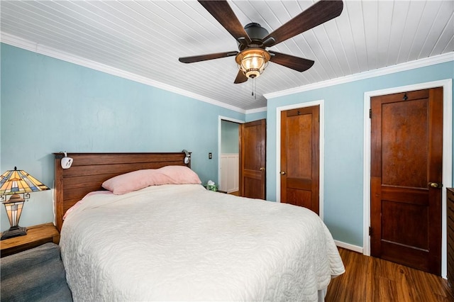 bedroom featuring ceiling fan, crown molding, and dark wood-type flooring