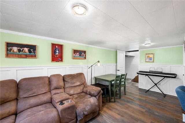 living room featuring dark hardwood / wood-style flooring and ornamental molding