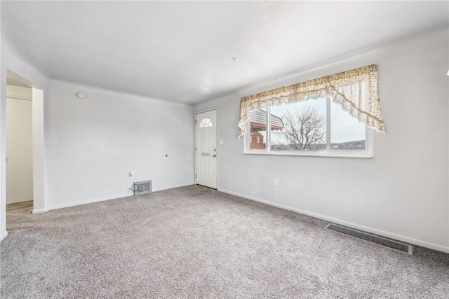 unfurnished room featuring carpet