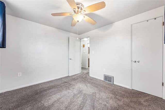 spare room with carpet flooring and ceiling fan