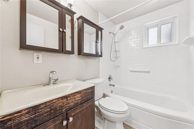 full bathroom with vanity, toilet, and tiled shower / bath