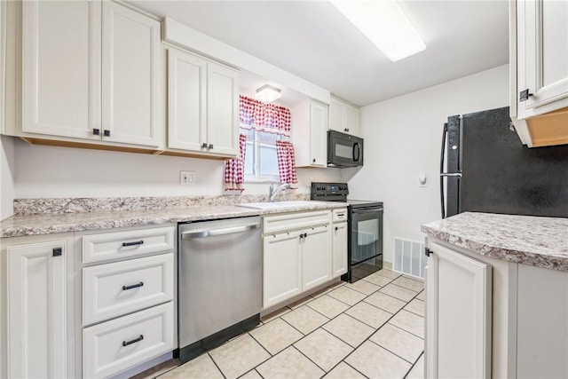 kitchen with sink, white cabinetry, and black appliances