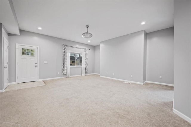 interior space with light carpet and plenty of natural light