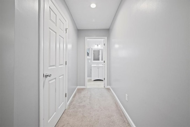 corridor with light colored carpet