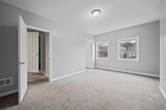 unfurnished bedroom with carpet flooring