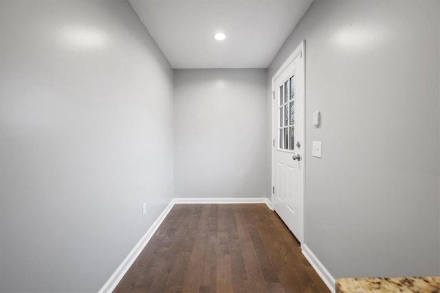 doorway with dark hardwood / wood-style floors