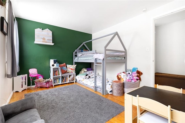 bedroom with hardwood / wood-style floors