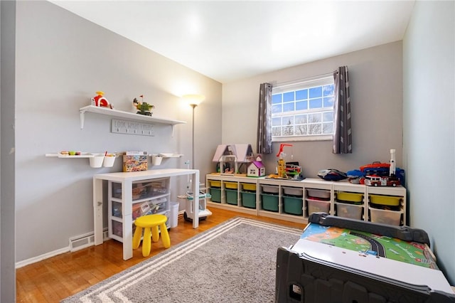 playroom with hardwood / wood-style floors