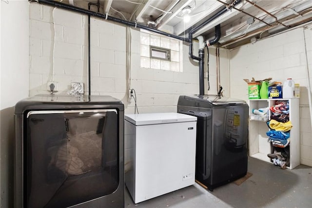 clothes washing area featuring independent washer and dryer