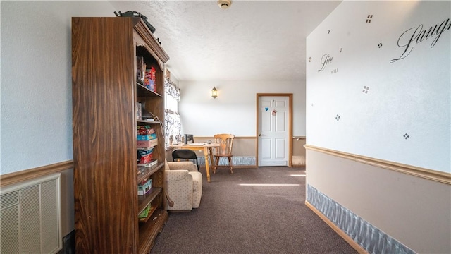 interior space featuring dark colored carpet