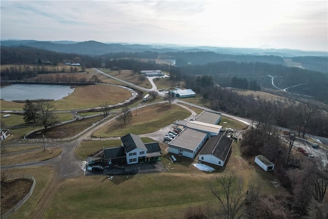 birds eye view of property featuring a water and mountain view