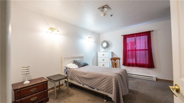 bedroom featuring baseboard heating and carpet flooring