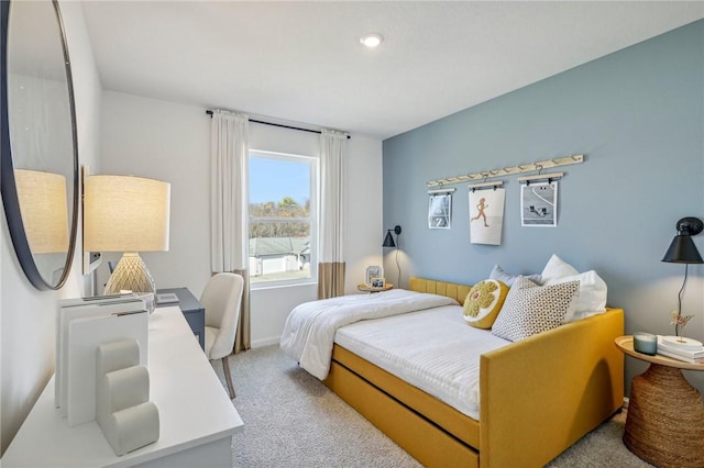 bedroom with light colored carpet