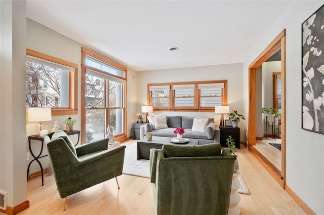 living room with light hardwood / wood-style flooring