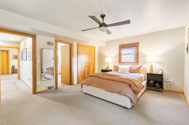 carpeted bedroom with ceiling fan