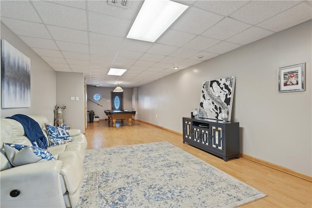 living room featuring hardwood / wood-style floors and billiards