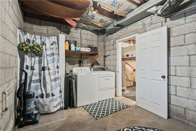 clothes washing area with independent washer and dryer