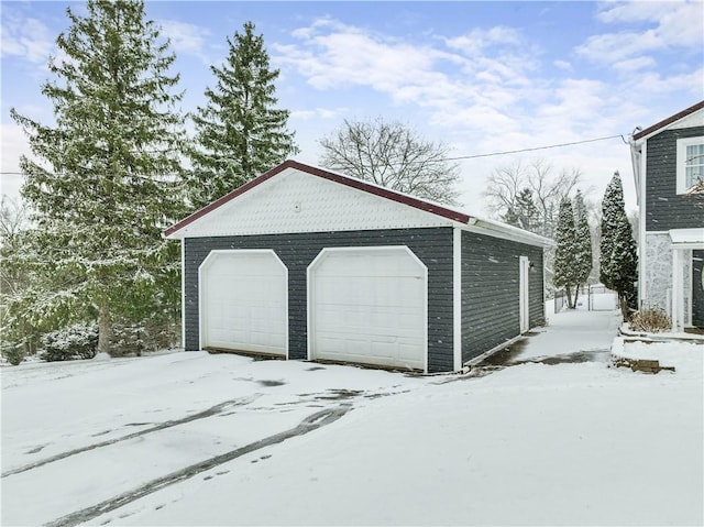 view of snow covered garage