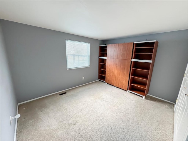 unfurnished bedroom featuring light colored carpet