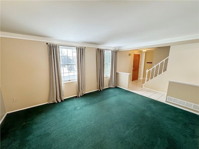 carpeted spare room with crown molding