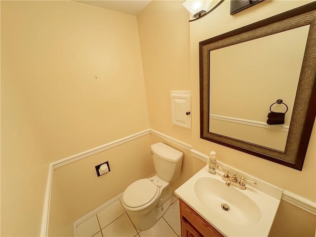 bathroom with tile patterned floors, vanity, and toilet