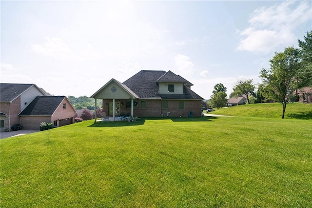 view of front of property with a patio area and a front lawn