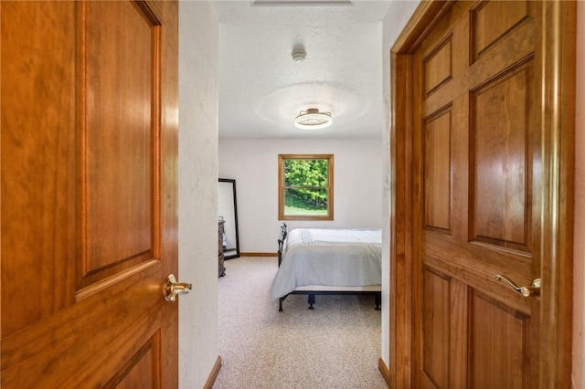 bedroom with light carpet