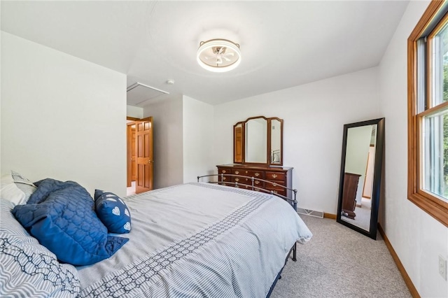 bedroom featuring light colored carpet