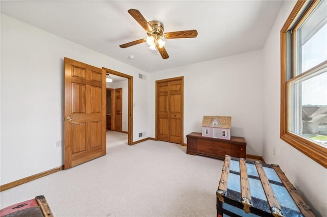 carpeted bedroom with ceiling fan