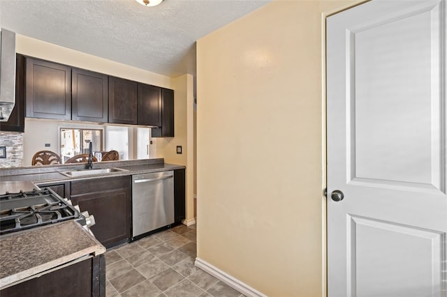 kitchen featuring dark brown cabinetry, dishwasher, a textured ceiling, and sink