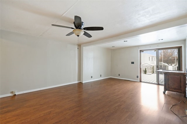 unfurnished living room featuring ceiling fan and wood-type flooring