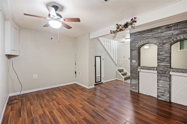 unfurnished room featuring dark hardwood / wood-style flooring and ceiling fan