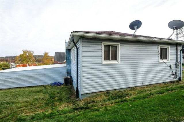 view of side of property with a yard