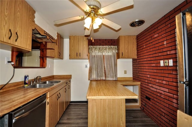 kitchen featuring brick wall, ceiling fan, dark wood-type flooring, sink, and dishwasher