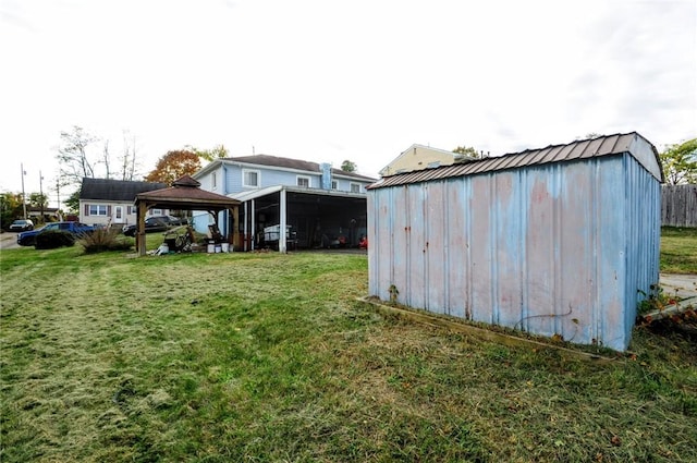 view of outdoor structure featuring a gazebo and a lawn