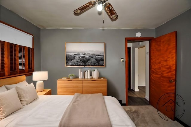 bedroom with ceiling fan and hardwood / wood-style floors