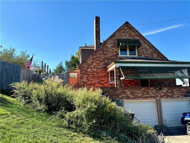 view of side of property featuring a garage