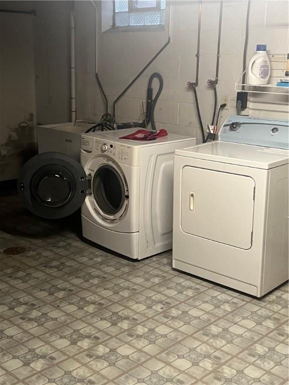 washroom featuring washer and clothes dryer