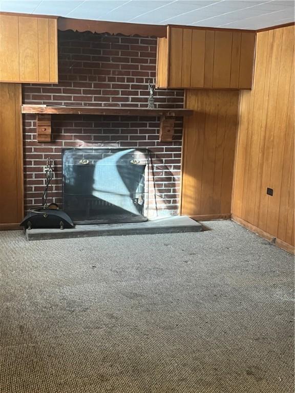 room details with carpet flooring and wooden walls