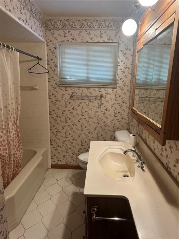 full bathroom featuring tile patterned flooring, vanity, shower / tub combo, and toilet